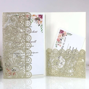 Elegant laser cut royal blue wedding invitation card with glitter finish and floral insert