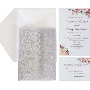 Laser cut wedding invitation set with silver glitter cover and pink floral inner card