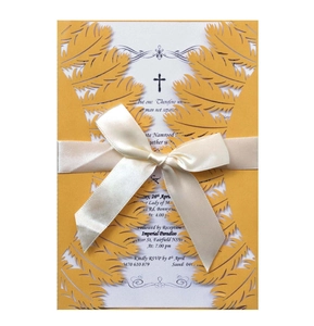 Elegant mustard yellow laser-cut feather wedding invitation with white silk bow