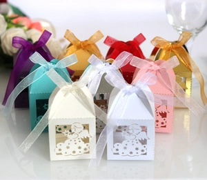 Laser-cut angel candy boxes with silk ribbons in multiple colors for wedding parties