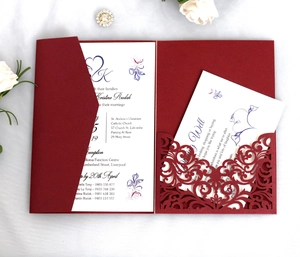 Elegant burgundy laser-cut wedding invitation set with floral inner cards on white silk