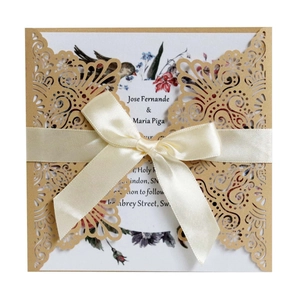 Laser-cut floral invitations with kraft paper cover, colorful insert and cream bow