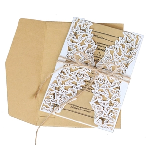 Laser cut white butterfly wedding invitation with kraft insert and twine closure set