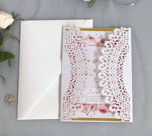 Elegant blue laser cut wedding invitation set with floral inner card and white envelope