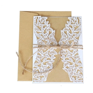 Laser-cut white butterfly wedding invitation card with kraft paper and hemp rope bow