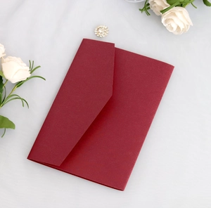 Elegant burgundy wedding invitation envelope with pearl texture on white floral background