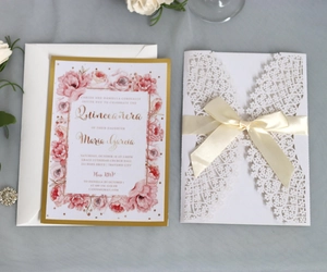 Elegant laser-cut hollow blue crown invitation card set with floral inner and bow