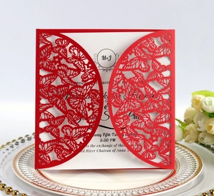 Intricate red laser-cut butterfly wedding invitation card with elegant floral rose decor