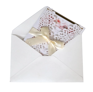Elegant laser cut lace wedding invitation set with floral inner card and satin ribbon