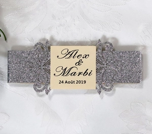 Intricate laser-cut silver glitter belly band for elegant wedding invitation cards