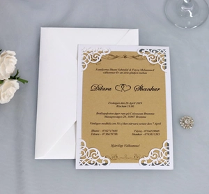 Elegant white laser cut wedding invitation set with kraft insert and white envelope