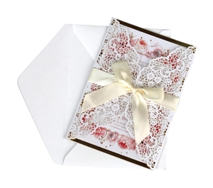 Lace hollow laser cut wedding invitation with pink floral insert and white ribbon bow