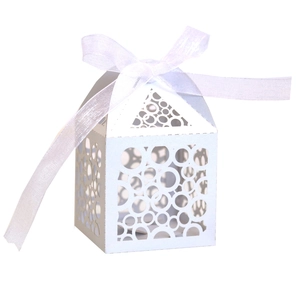 Elegant white laser-cut favor box with circular patterns and matching satin ribbon bow