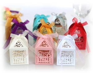 European laser-cut candy boxes with ribbons and hollow heart fence for wedding favors
