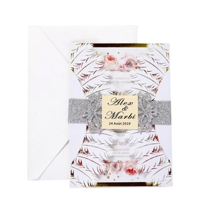 Elegant laser cut white lace wedding invitation set with silver glitter belly band