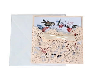 Pink laser-cut lace wedding invitation set with cream ribbon and white envelope