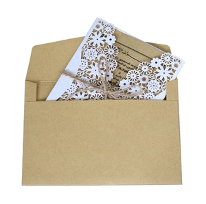 Elegant laser cut white flower wedding invitation cards with kraft paper envelope and twine