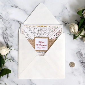 Elegant laser cut wedding invitation with gold glitter band and custom name tag