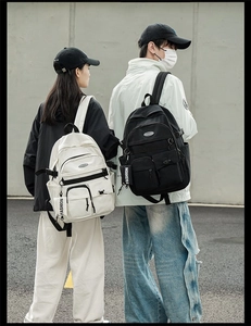 Outdoor shot of minimalist large capacity backpacks with multiple pockets and fashion tags