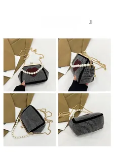 Detailed views of heart rhinestone evening bag with pearl handle and gold chain