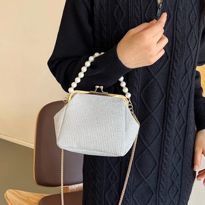 Elegant silver sequin evening clutch bag with pearl handle and golden chain strap