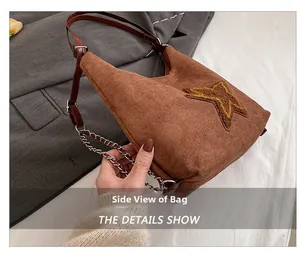 Side view of vintage brown suede tote with plush star pattern and metal chain strap