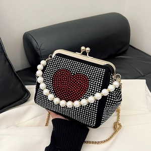 Black evening clutch with red rhinestone heart, pearl handle and gold chain strap