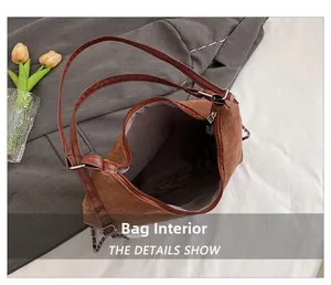 Detailed interior of the brown matte tote bag showing the zipper and gray fabric lining