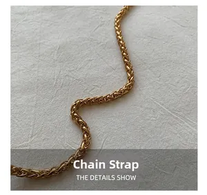 Close-up of golden metal chain strap with wheat-style weave for women bucket bag