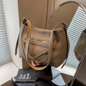 Chic beige lychee grain leather tote bag with gold chain and adjustable shoulder strap