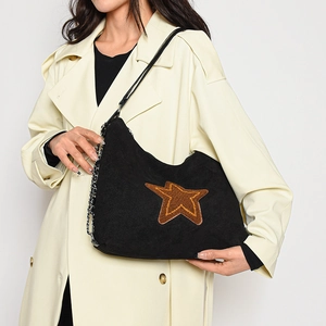 Vintage frosted black crescent tote bag with brown plush star patch and metal chain strap