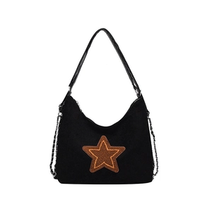 Vintage black suede tote bag with yellow star patch and silver metal chain straps