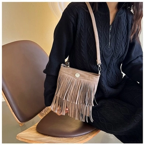 Vintage brown fringe bucket bag for women with adjustable shoulder strap and metal buckle