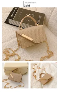 Detail of gold woven texture crossbody bag with metallic bar and chain strap