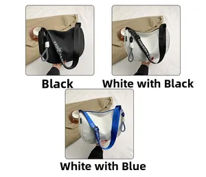 Close-up of three trendy shoulder bags with 'FASHION & BAG' lettered webbing straps