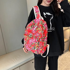 Fashionable red floral backpack with traditional peony patterns for women traveling