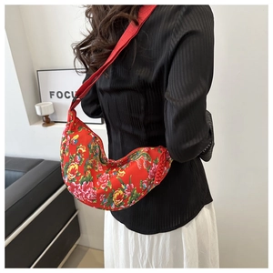 Detailed close-up of the red semi-circle shoulder bag featuring traditional peony floral patterns