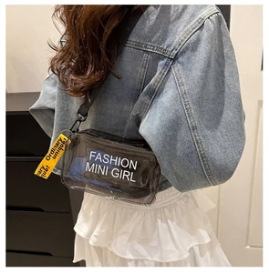Detail view of a black transparent PVC mini crossbody bag with fashion letter printing