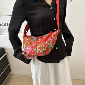 Ethnic style crossbody canvas bag with traditional red floral pattern and tassel detail