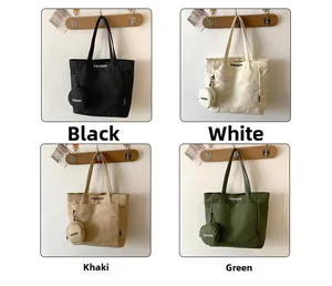 Detailed view of canvas tote bag colors including black, white, khaki and green with pouches