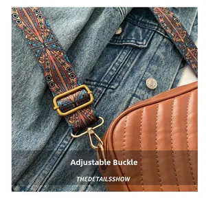 Detail of woven retro shoulder strap with golden buckles on a brown quilted crossbody bag