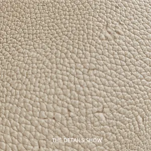 Macro shot of high-quality lychee grain faux leather in oatmeal beige for tote bags