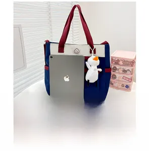 Large canvas tote bag with contrast colors and iPad inside for size comparison