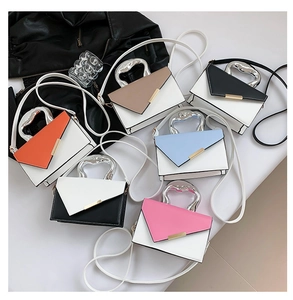 Detail view of colorful trapezoid handbags with stylish irregular fluid silver metal handles