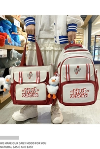 Red and white canvas tote and backpack set featuring cute duck charms and printed text