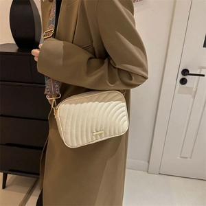 Chic beige quilted crossbody bag with wide ethnic shoulder strap for stylish women