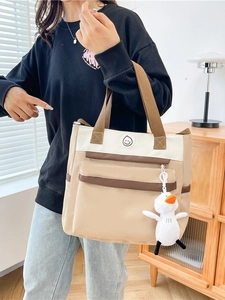 Three-color canvas tote bag for students featuring a smiley patch and duck plush charm