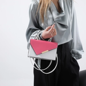 Minimalist two-tone crossbody bag with white leather, pink flap and silver metal handle
