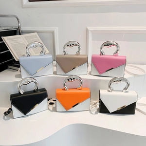 Minimalist square crossbody bag with unique irregular silver handle and contrast colors