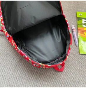 Detail view of the spacious inner compartment and large capacity of the floral backpack